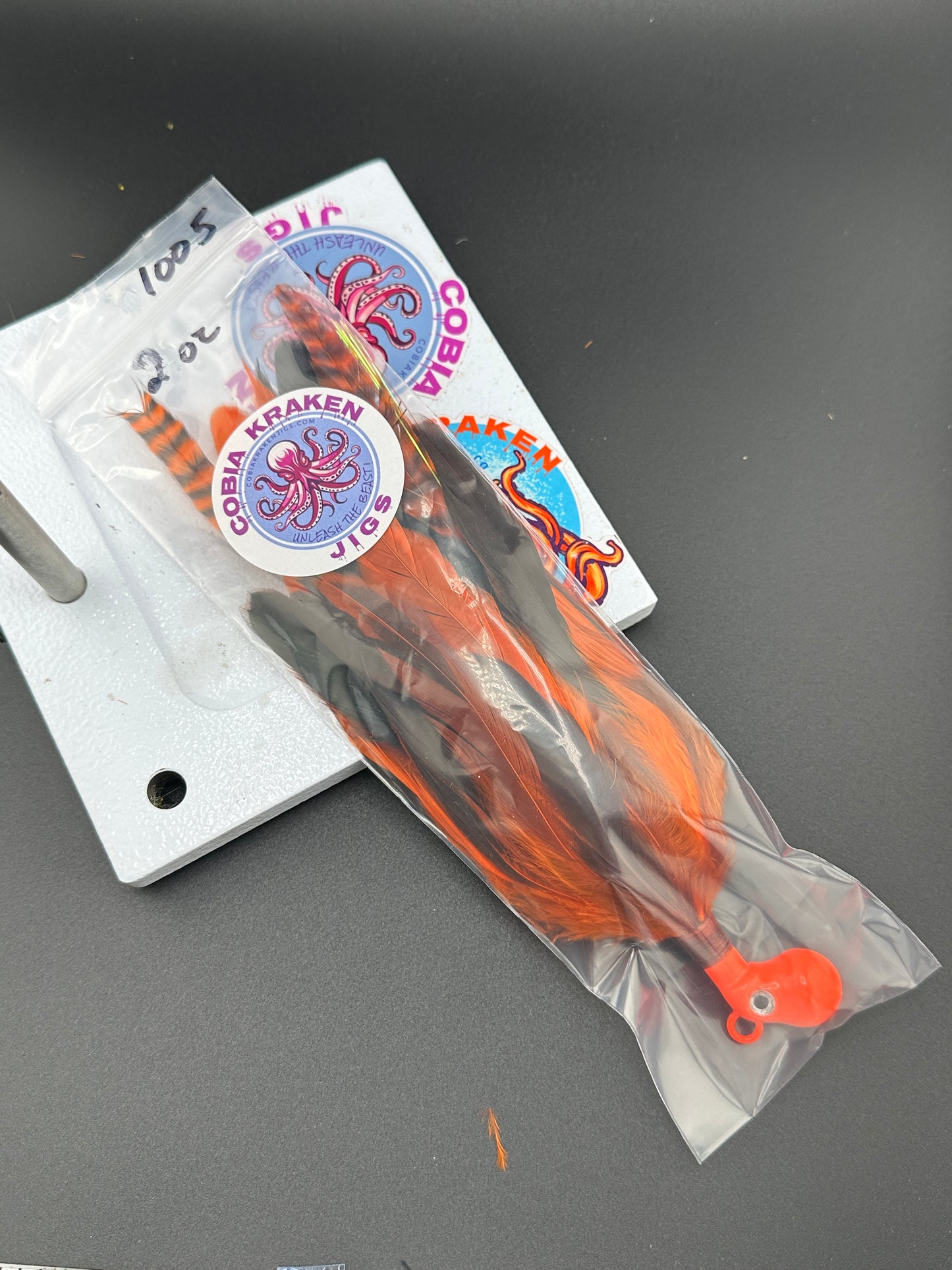 Orange and black cobia jig cobiakrakenjigs.com