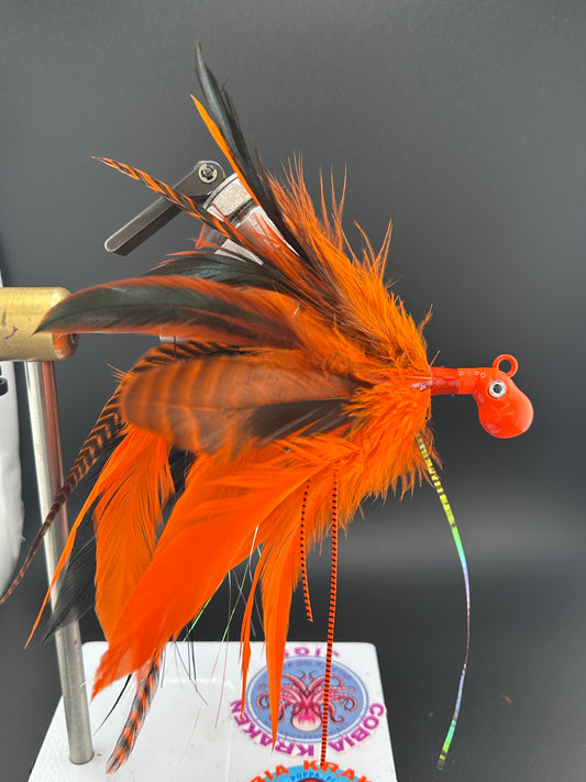 Grizzly orange and black feather saltwater custom jig for cobia fishing by cobiakrakenjigs.com